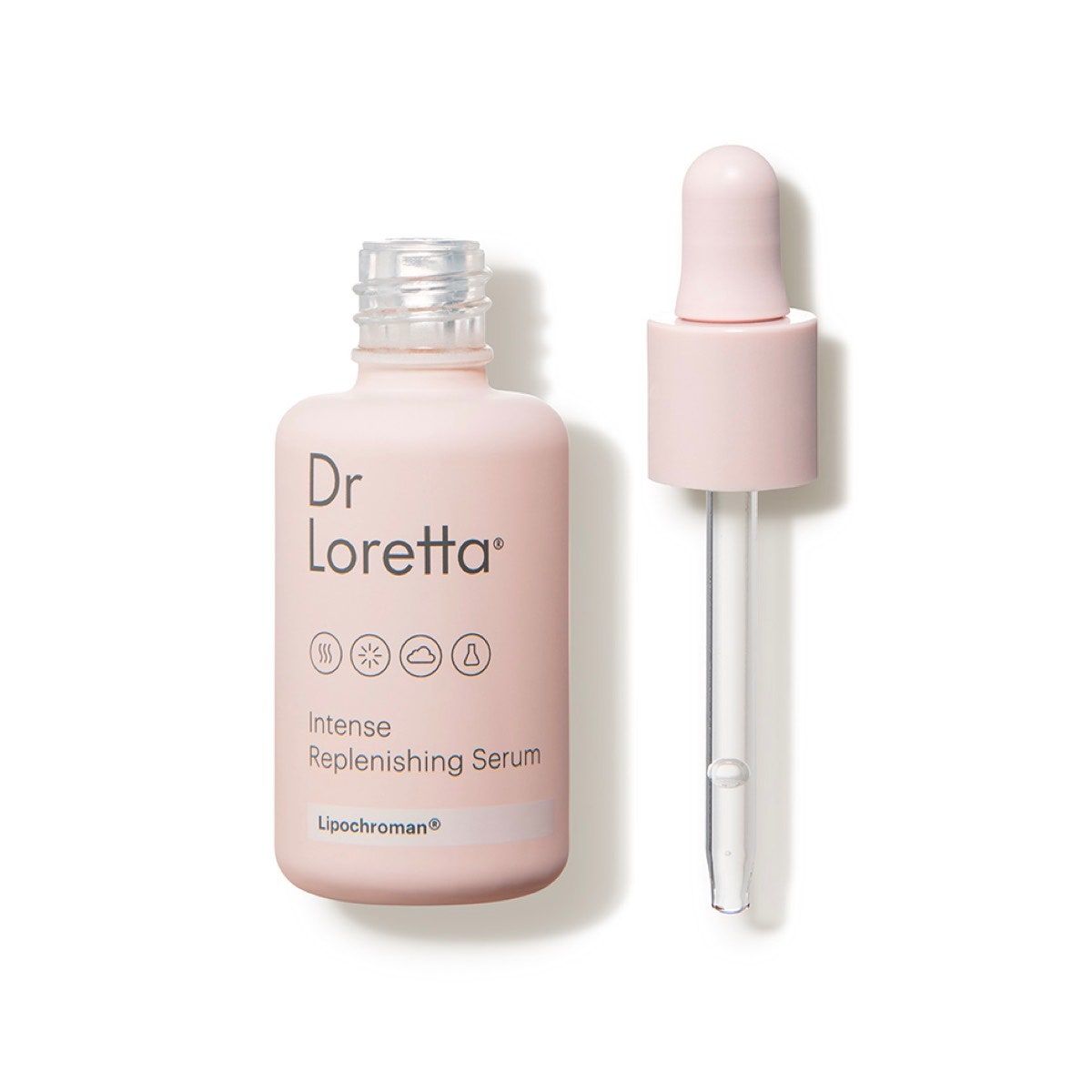 Una botella de color rosa claro de Dr. Loretta Replenishing Serum sobre un fondo blanco.
