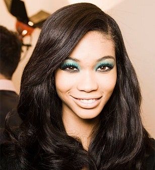 La imagen puede contener cabello, cabello negro, rostro de persona humana y Chanel Iman.