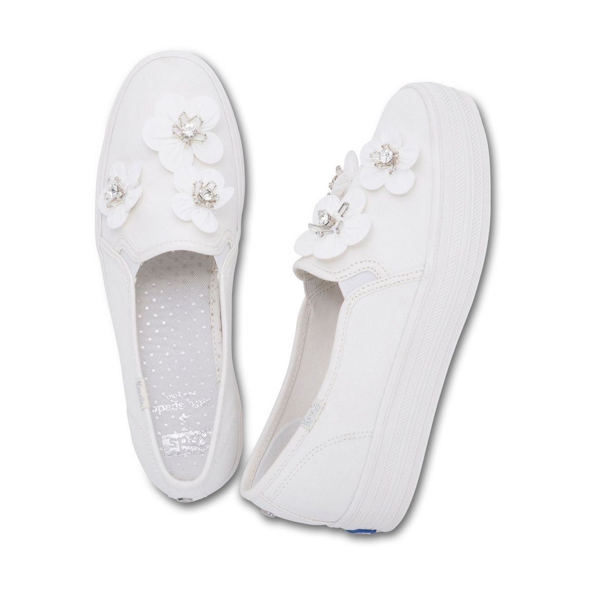 Slika lahko vsebuje Clothing Apparel Footwear in FlipFlop