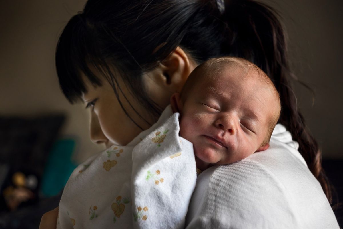 La imagen puede contener la persona humana del bebé recién nacido Anne Geddes y la cara