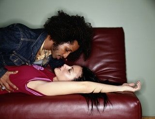 画像には、Make Out Human Person Furniture Pants Clothing Apparel andHugが含まれている場合があります