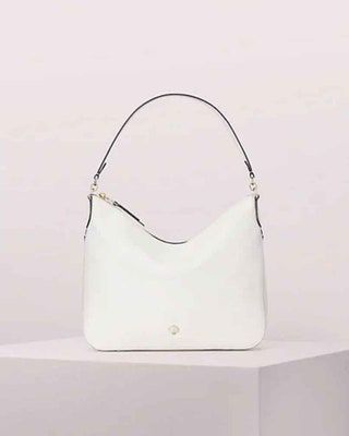 画像にはハンドバッグアクセサリーアクセサリーバッグと財布が含まれている場合があります