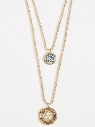 La imagen puede contener accesorios y accesorios de collar de joyería colgante