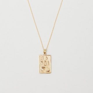 La imagen puede contener accesorios y accesorios de joyería de collar colgante