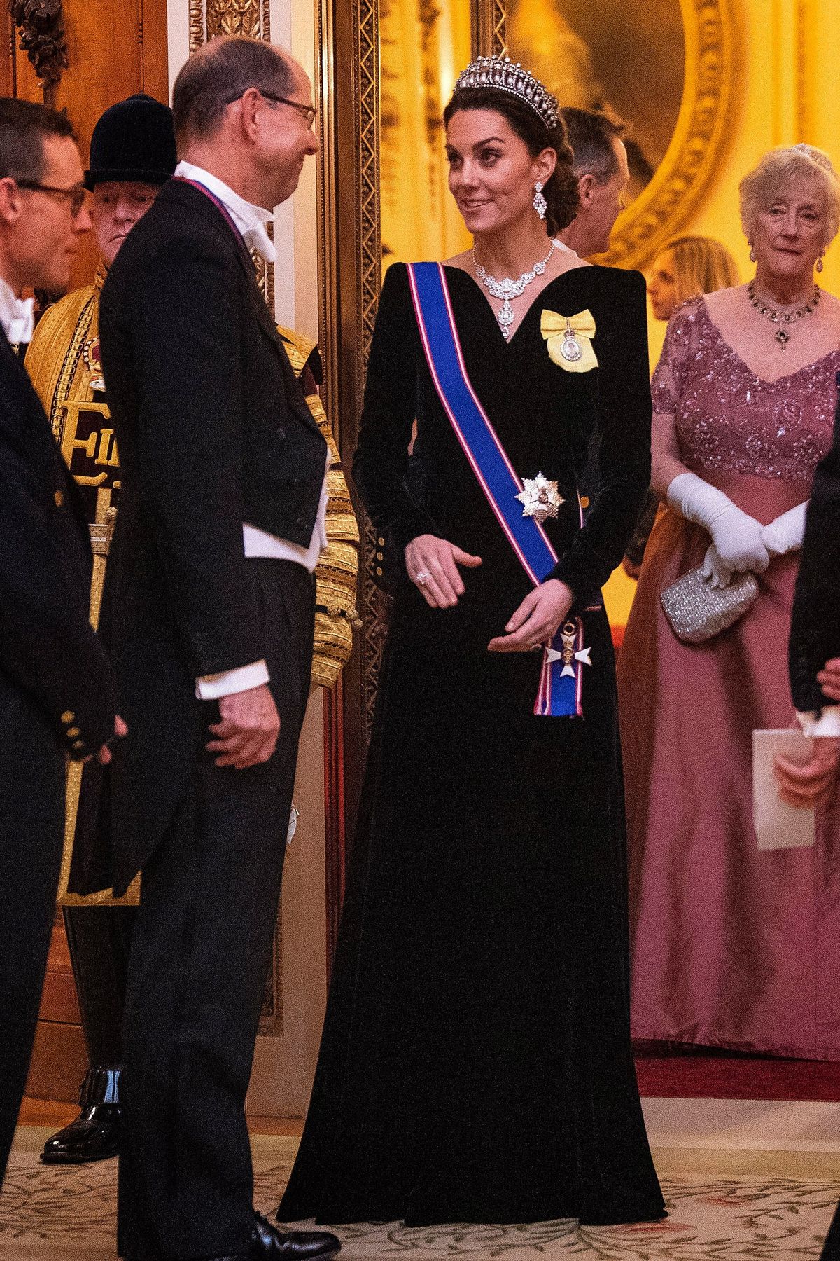 Kate Middleton dalyvauja priėmime Bekingemo rūmuose 2019 m. gruodžio mėn.