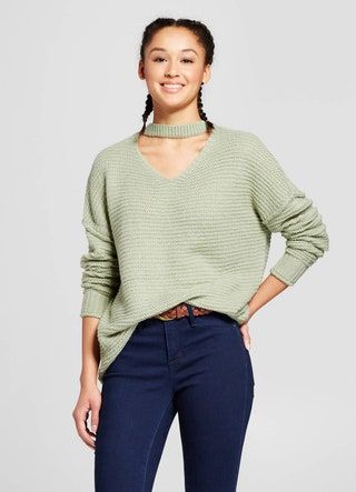 La imagen puede contener ropa, ropa, suéter de manga, persona humana y manga larga.