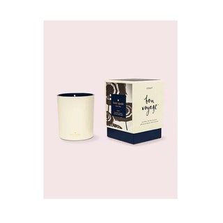 Vela de color negro y crema con caja y detalles gráficos