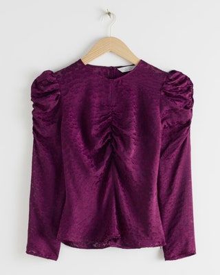 La imagen puede contener Ropa Blusa de manga larga y manga