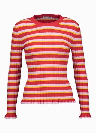 La imagen puede contener ropa, manga, ropa, manga larga y camisa