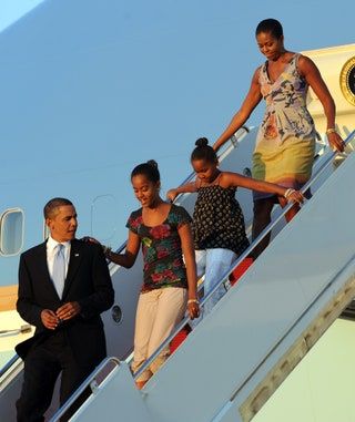 Bilden kan innehålla Människoperson Kostym Kappa Kläder Överrock Kläder Michelle Obama People och Marion Jones