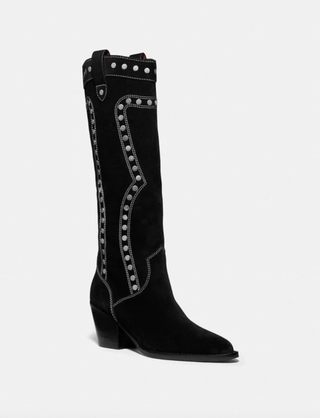 La imagen puede contener ropa, calzado, botas y botas de montar